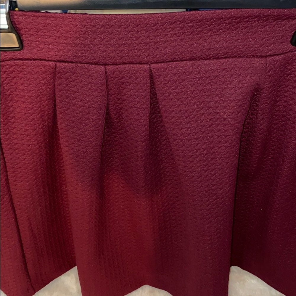 Red pleated skirt